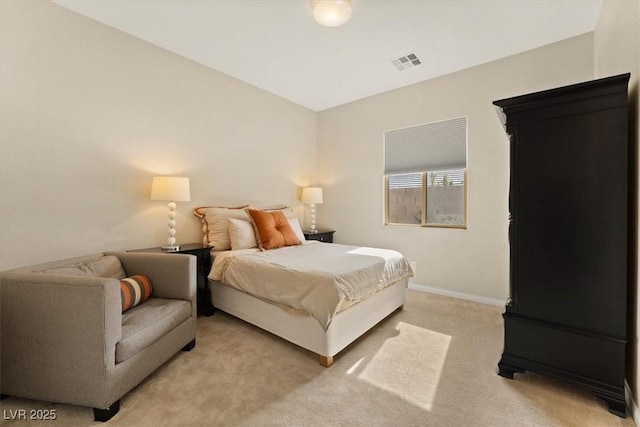 bedroom featuring light colored carpet