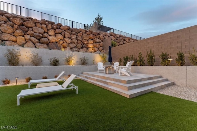 exterior space with a patio area and a fire pit