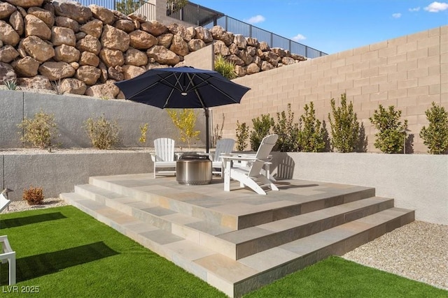 view of patio / terrace with an outdoor fire pit