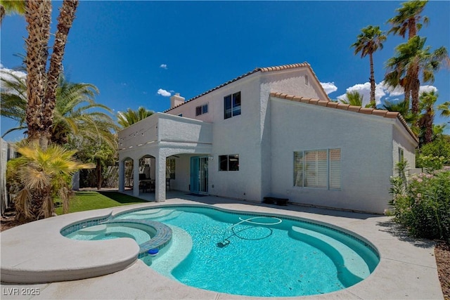 view of swimming pool with a patio area