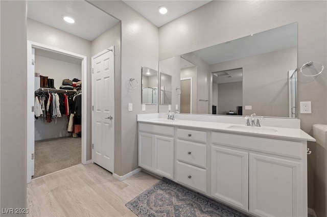 bathroom featuring vanity and wood-type flooring