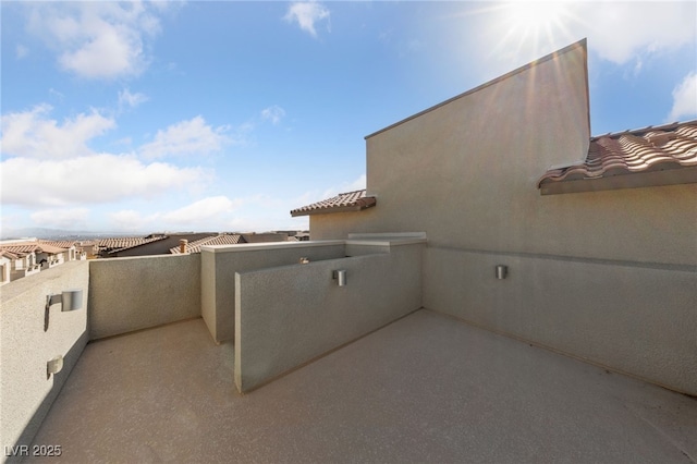 view of patio with a balcony