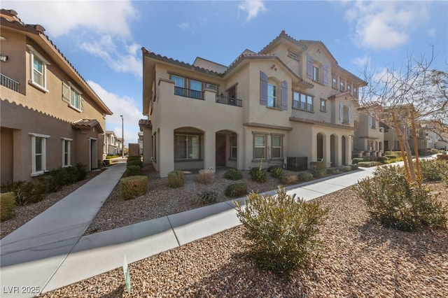 mediterranean / spanish house featuring central AC