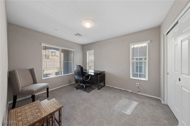 office area featuring light colored carpet