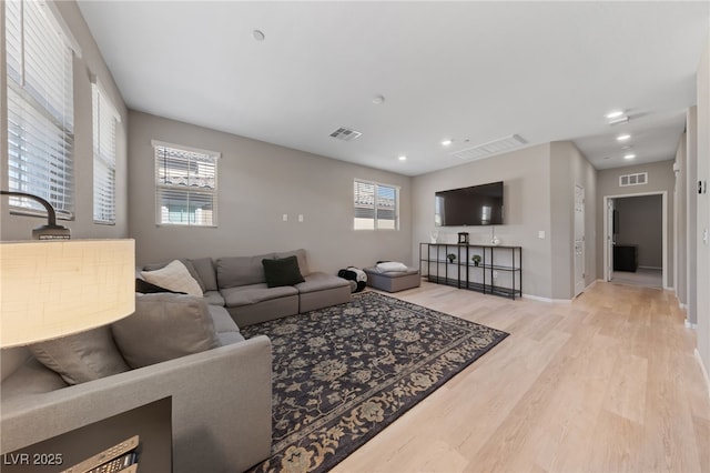 living room with light hardwood / wood-style floors