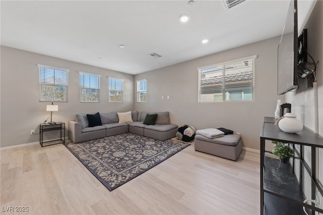 living room with light hardwood / wood-style flooring