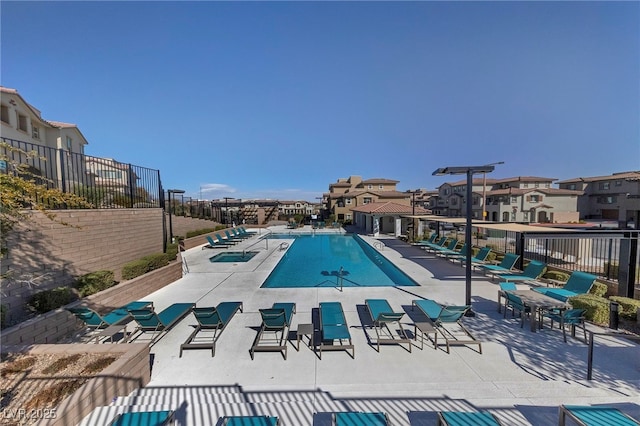 view of swimming pool featuring a patio area