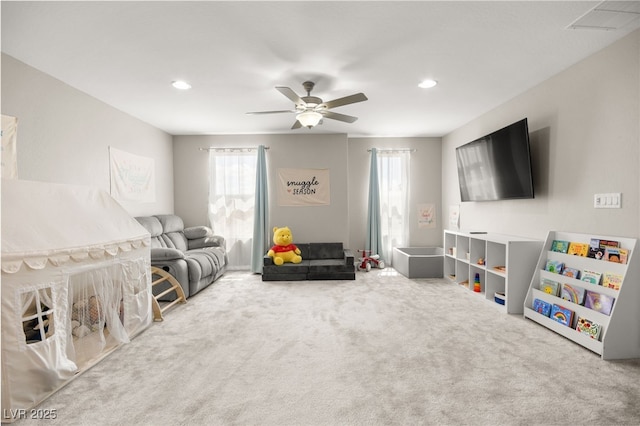 living room with carpet floors and ceiling fan