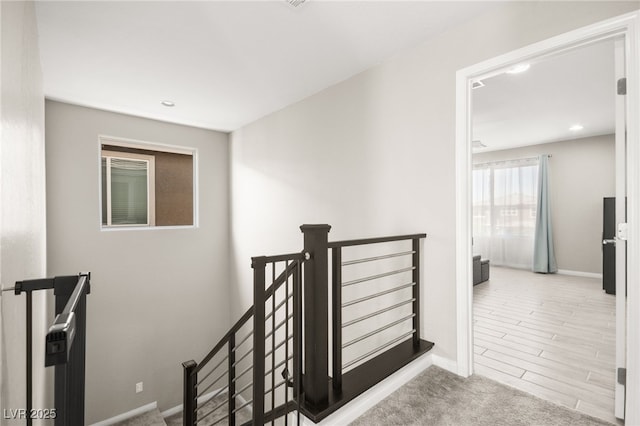 staircase with carpet floors