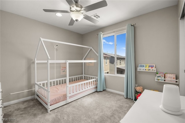 bedroom with ceiling fan and carpet