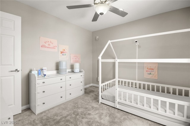 bedroom featuring ceiling fan and light carpet