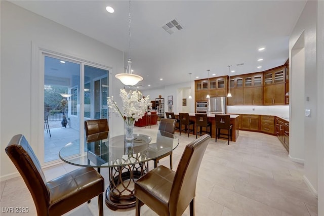 dining room featuring light tile patterned floors