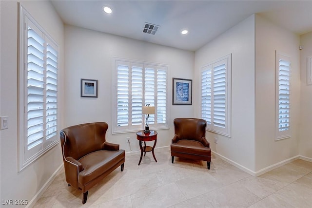 sitting room featuring light tile patterned floors