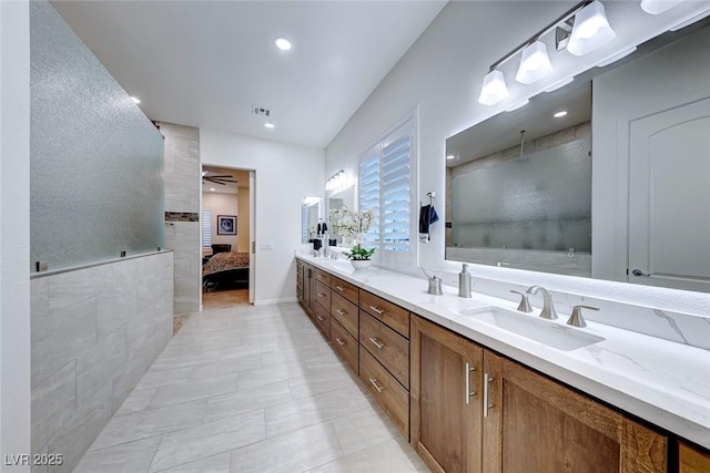 bathroom featuring vanity, a shower, and ceiling fan