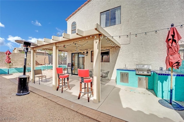 view of patio / terrace featuring outdoor dining space, a grill, fence, and area for grilling