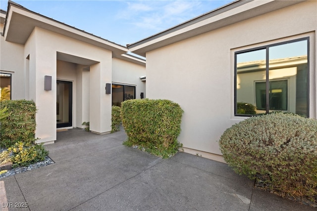 doorway to property with a patio area