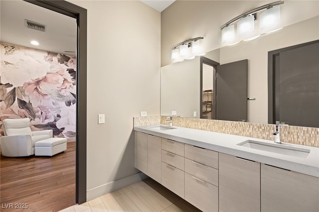 bathroom featuring hardwood / wood-style flooring and vanity