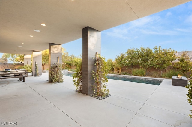 view of patio featuring a fenced in pool