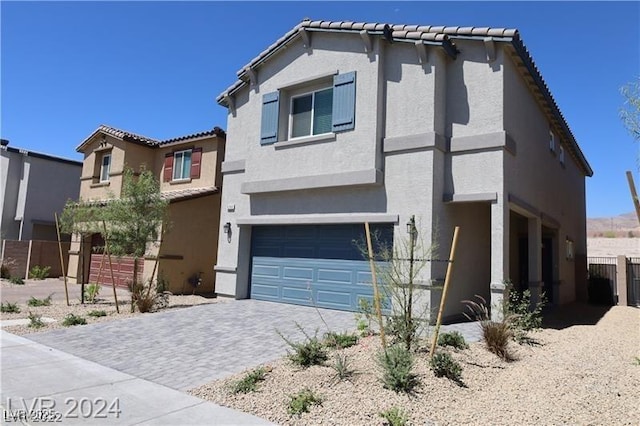 view of front of property with a garage