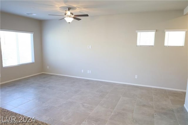 spare room featuring ceiling fan