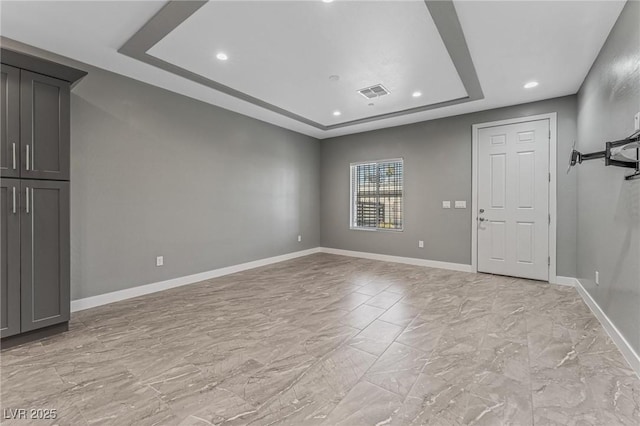 empty room with a tray ceiling