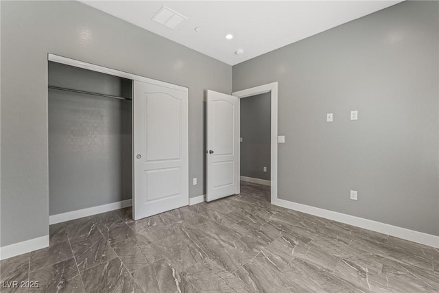 unfurnished bedroom with a closet