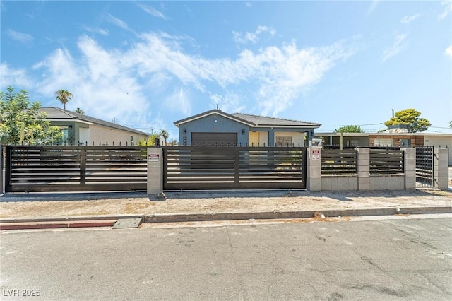 view of gate featuring a garage