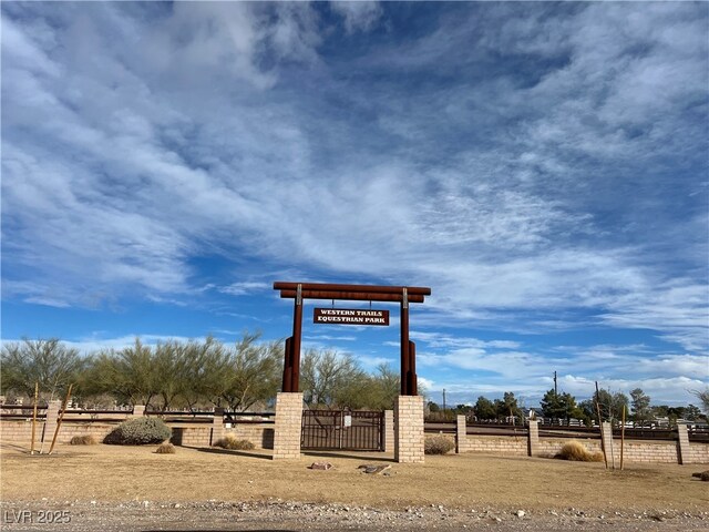 surrounding community with a rural view and fence