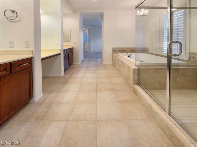 7719 Windy Meadow Ave, Las Vegas, NV 89178 - bathroom with vanity, a bath, tile patterned flooring, a stall shower, and a chandelier