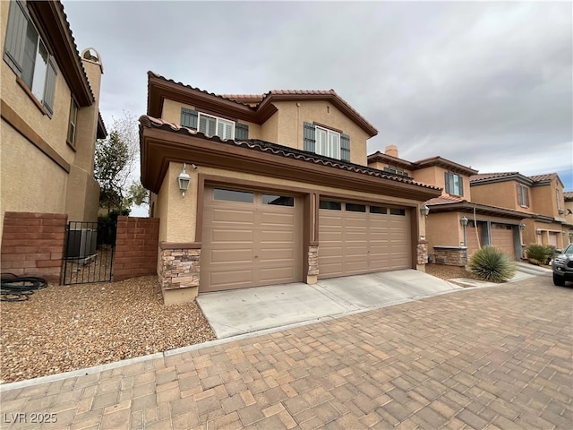 7719 Windy Meadow Ave, Las Vegas, NV 89178 - view of front of home featuring driveway, stone siding, stucco siding, and a tiled roof