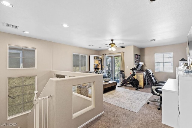 carpeted home office featuring visible vents and recessed lighting