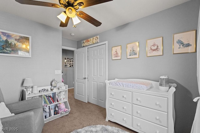 bedroom with light carpet, a ceiling fan, and a closet