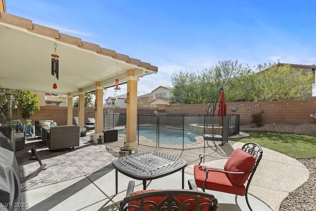 view of patio with an outdoor hangout area, a fenced backyard, and a fenced in pool