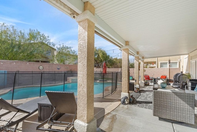 view of patio / terrace with an outdoor hangout area, a fenced backyard, and a fenced in pool