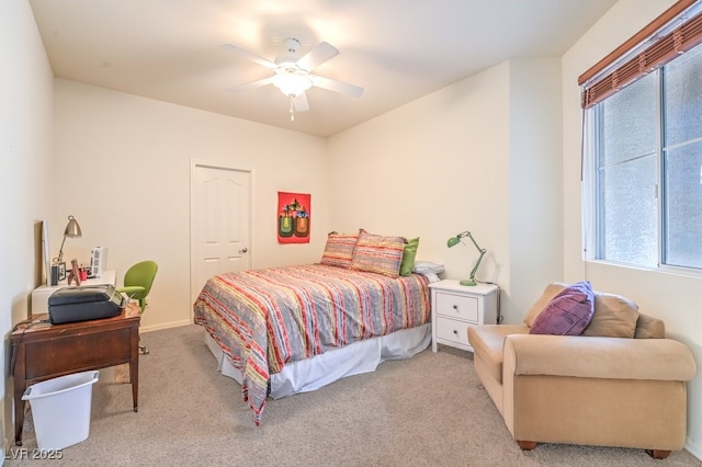 bedroom with light colored carpet and ceiling fan