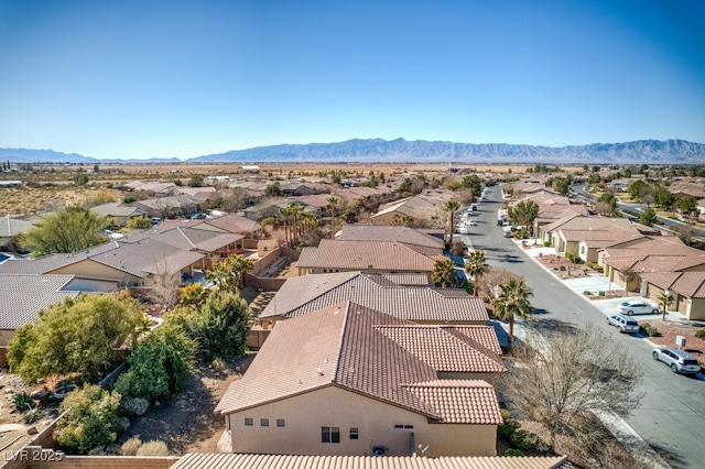 birds eye view of property with a mountain view