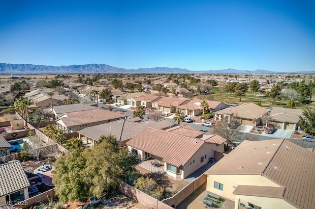 birds eye view of property with a mountain view