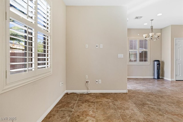 tiled empty room featuring a notable chandelier, recessed lighting, visible vents, and baseboards