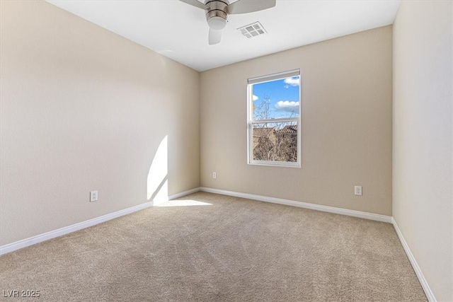 empty room featuring baseboards, visible vents, ceiling fan, and carpet flooring