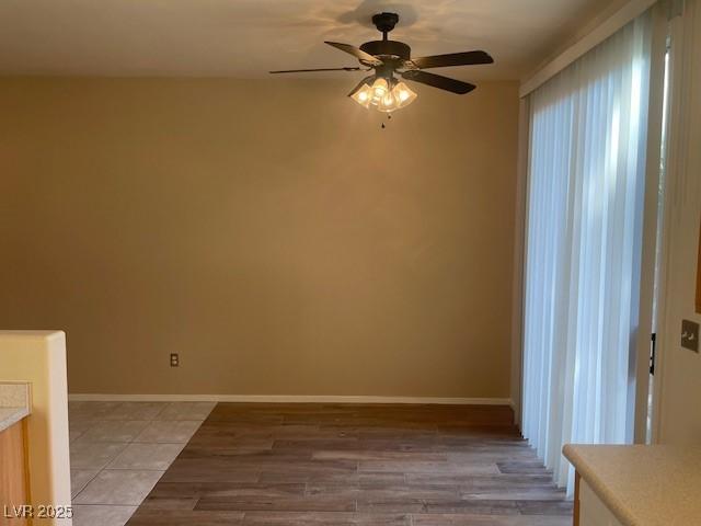 unfurnished room featuring ceiling fan and light hardwood / wood-style flooring