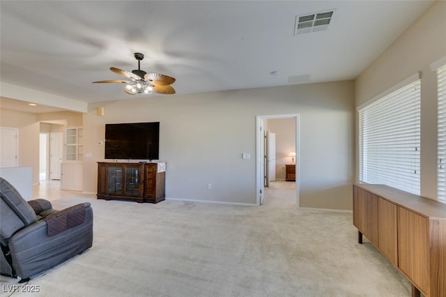 living room featuring light colored carpet and ceiling fan