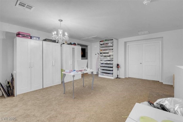 carpeted bedroom featuring a chandelier