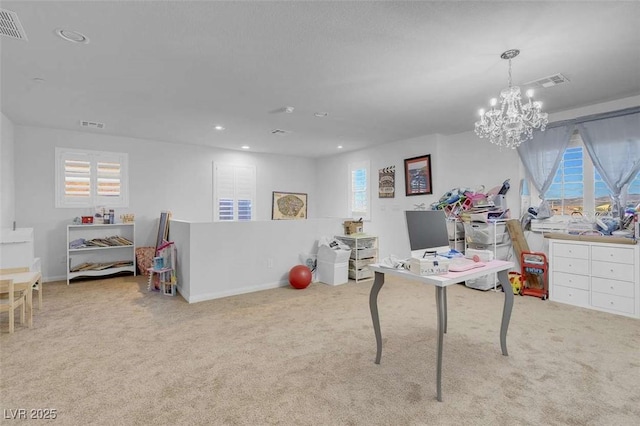 recreation room with light carpet, a chandelier, and a healthy amount of sunlight