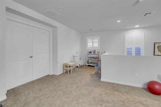 interior space featuring light colored carpet