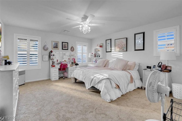 carpeted bedroom with ceiling fan