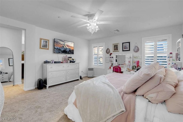 bedroom with light carpet and ceiling fan