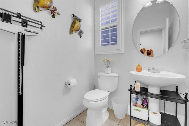 bathroom featuring tile patterned floors and toilet