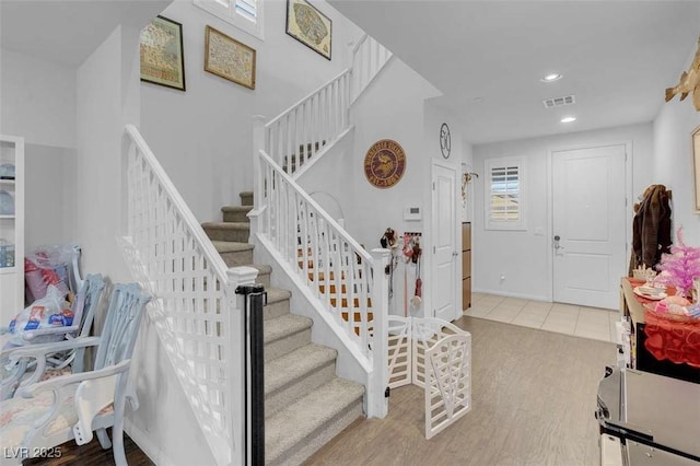 staircase featuring hardwood / wood-style flooring