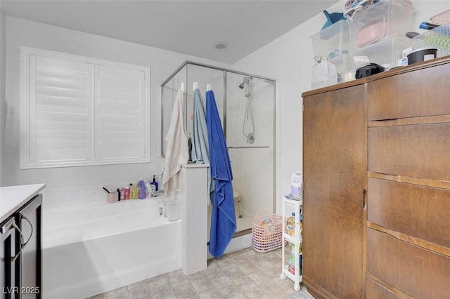 bathroom with independent shower and bath and vanity