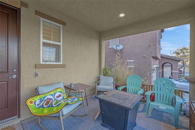 view of patio with an outdoor fire pit